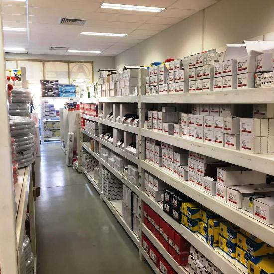 Inside the AEW Electrical Wholesalers warehouse - shelves stocked with electrical supplies